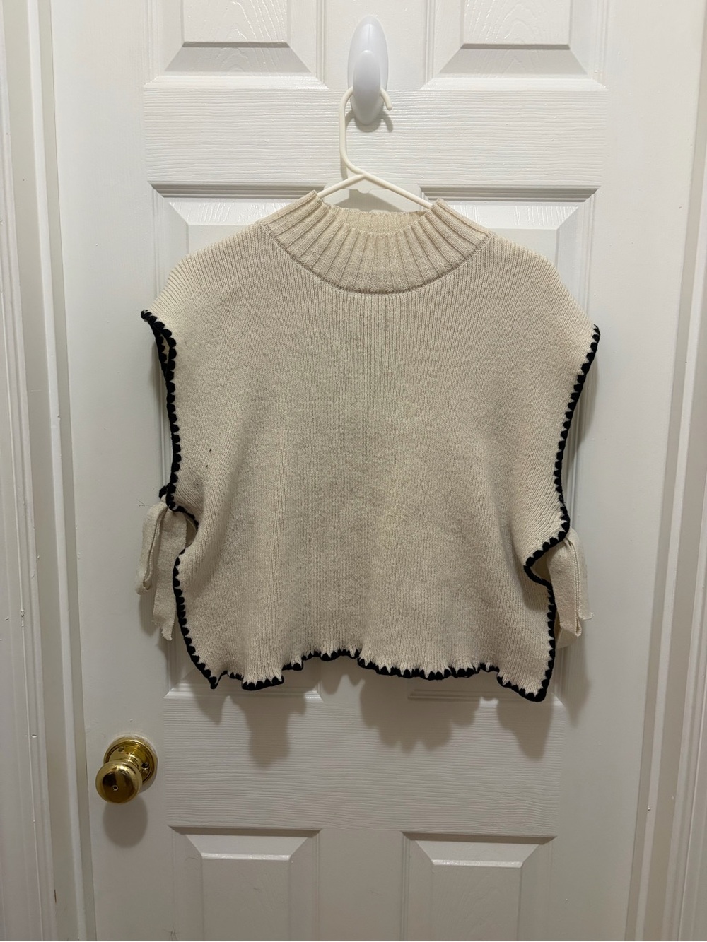 Amazon Cream Knit Sleeveless Turtleneck Poncho with Black Trim